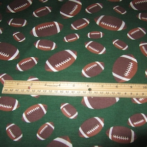 Green With Brown Multi-sized Football Flannel Fabric By The Yard
