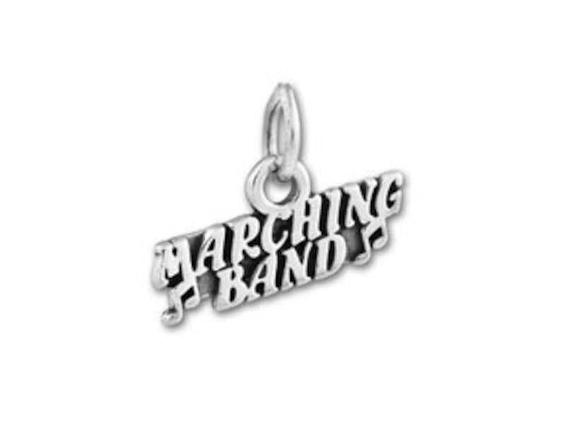 May include: Silver charm with the words "Marching Band" and a musical note.