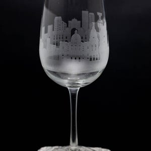 a wine glass sitting on top of a rock