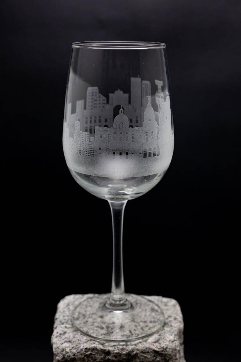 a wine glass sitting on top of a rock