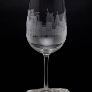 a wine glass sitting on top of a rock