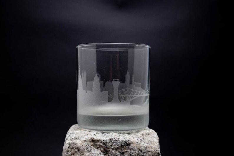 a glass sitting on top of a rock