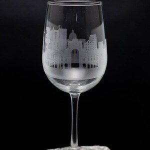 a wine glass sitting on top of a rock
