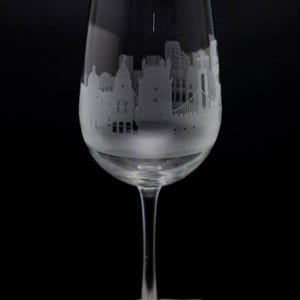 a wine glass sitting on top of a rock