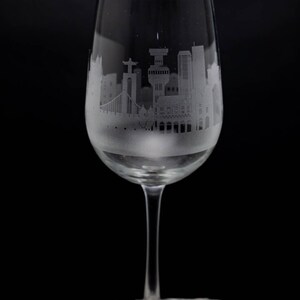 a wine glass sitting on top of a rock