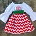 Cheryl Schlosnagle reviewed Girls Red Chevron Christmas Dress, baby girl Christmas outfit, Long Sleeves Monogrammed Peasant outfit with green sash