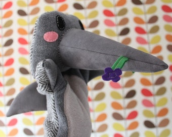 Dolphin hand puppet with flower