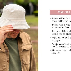 May include: A white bucket hat with a wide brim, made of a stiff material to prevent drooping. The hat is reversible, offering two different looks. The hat is worn by a person with a brown shirt.