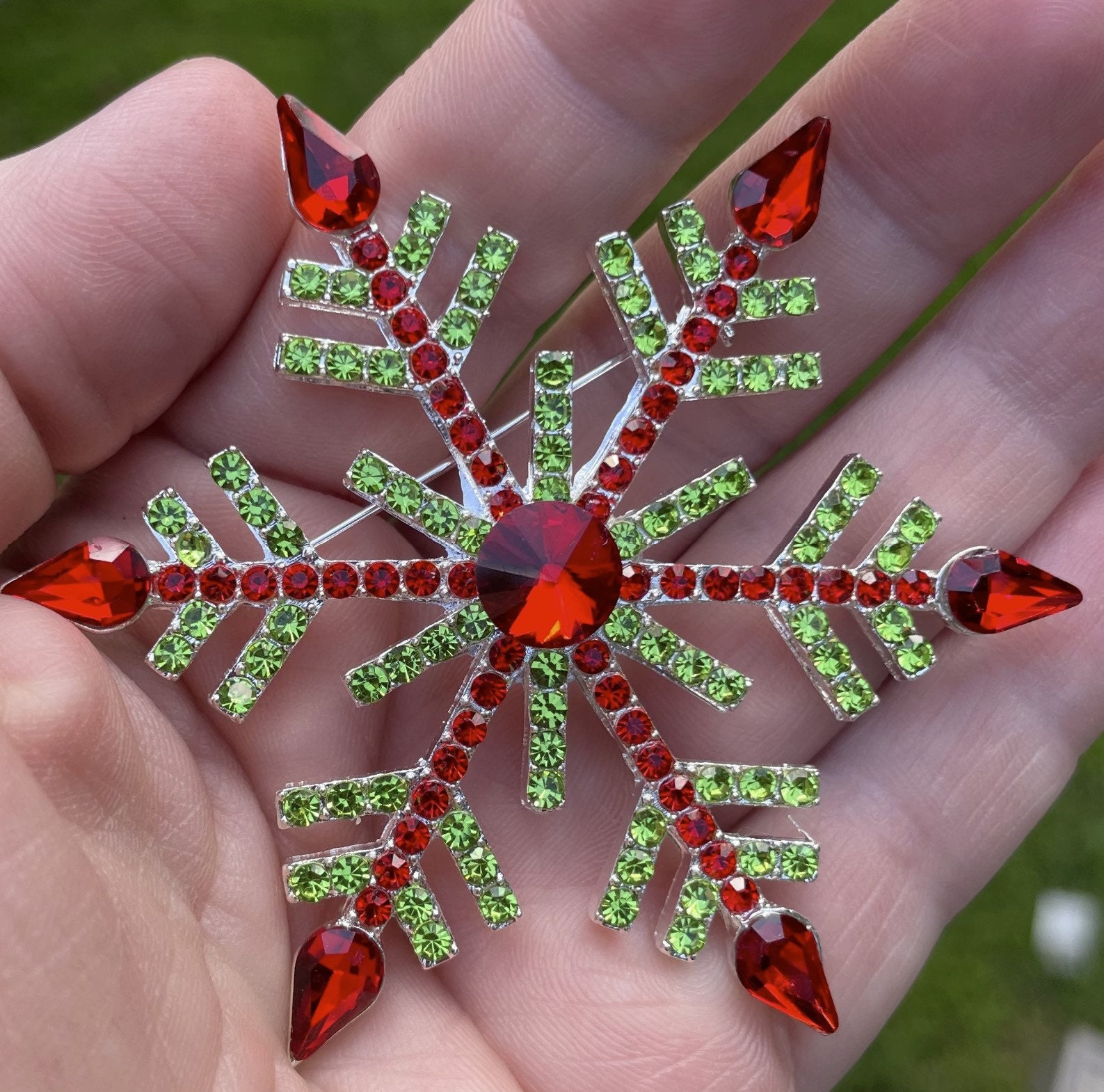 Spilla a forma di fiocco di neve rotante statement – & Co