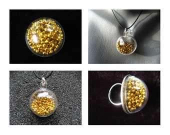 PROMOTION Bijoux bague collier boucles d'oreilles unisexes perles dorées mobiles sertie en résine dans une sphère en plexi diamètre 30mm