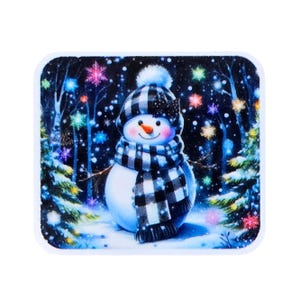 May include: A whimsical illustration of a snowman in a winter scene. The snowman wears a black and white plaid hat and scarf, with a carrot nose and a smiling face. The background features a snowy forest with colorful lights and snowflakes.