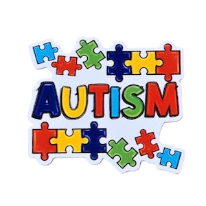 May include: A colorful puzzle-piece design with the word "AUTISM" in bold letters. The letters are outlined in yellow, with each letter in a different color. The puzzle pieces are red, blue, green, and yellow.