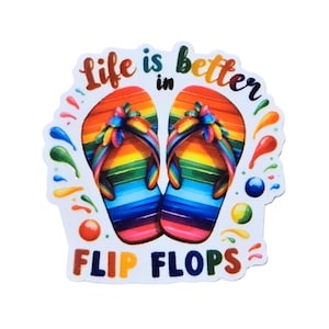 May include: A sticker featuring two rainbow-colored flip-flops with the text "Life is better in Flip Flops." The design includes colorful accents and a white background, perfect for summer.