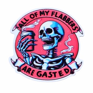 May include: A sticker featuring a blue and white skeleton holding a red coffee cup. The skeleton is set against a red background with the text "ALL OF MY FLABBERS ARE GASTED" in a banner.