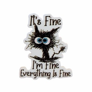 May include: A white ceramic button with a black cat illustration and the text "It's Fine I'm Fine Everything Is Fine".