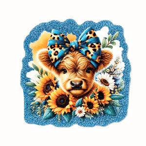 May include: A sticker featuring a fluffy brown Highland cow wearing a large blue leopard print bow. The cow is surrounded by vibrant yellow sunflowers, white daisies, and green leaves, all set against a bright blue glittery background.