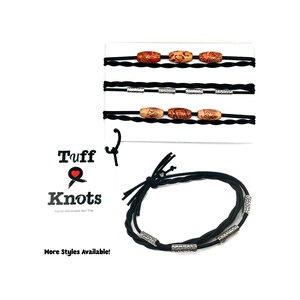 May include: Black bracelets with decorative beads. One bracelet features wooden beads, while another has silver-toned beads. The image also displays several similar bracelets on a white background. The text "Tuff Knots" and "More Styles Available!" are visible.