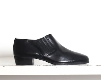 black leather minimal pull on shoes