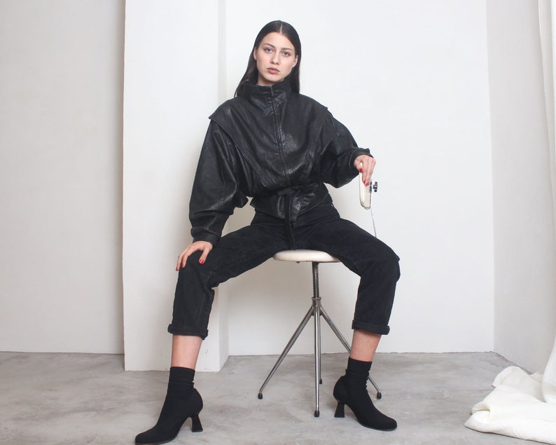 80s black futuristic avant garde batwing bomber jacket