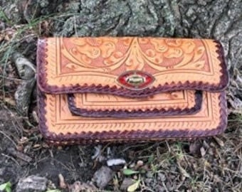 Vintage tooled leather clutch