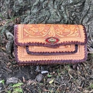 Vintage tooled leather clutch