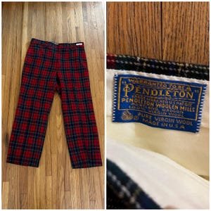 May include: Red, black, and green plaid pants. The pants are made of wool and have a Pendleton label. The label reads "Pendleton Woolen Mills, 100% Virgin Wool, Made in USA."