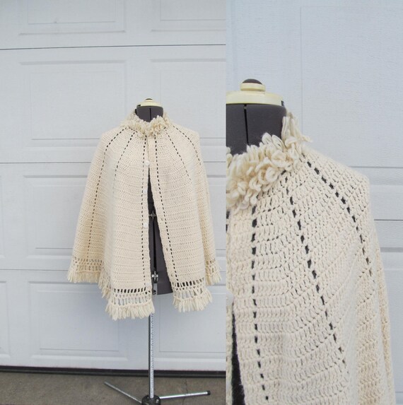 1970s cream hand knit poncho with bow print, wome… - image 1