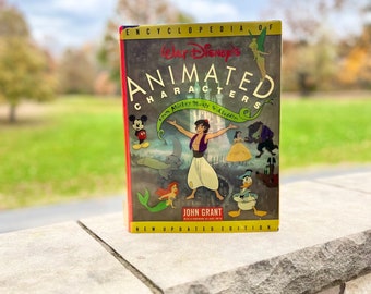 Libro vintage de tapa dura de Disney "Enciclopedia de personajes animados" de 1993.