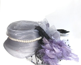 Gray Fascinator with tulle and pearls, accented with feather