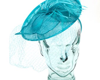 Aqua Sinamay headband fascinator, accented with feathers, flower and veil