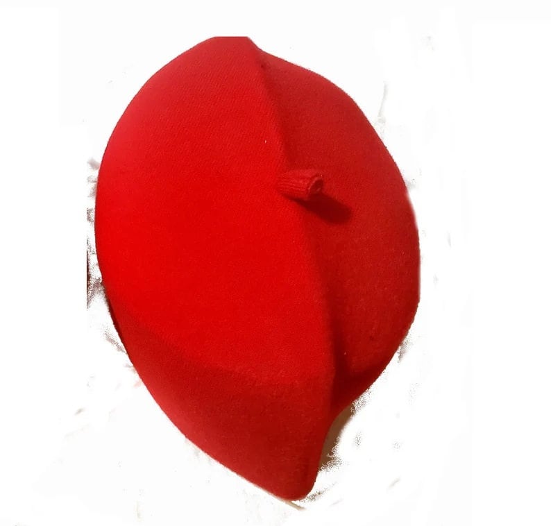 May include: A red beret made of felt.