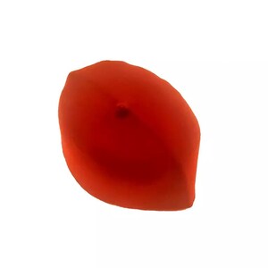 May include: A red felt fez hat with a small button on top.