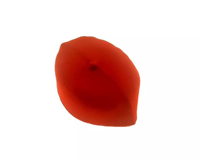 May include: A red felt fez hat with a small button on top.