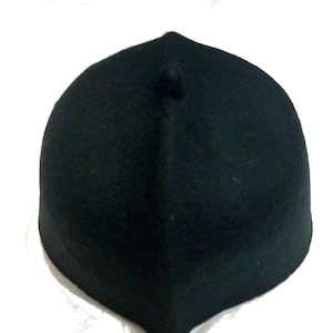 May include: A dark green felt fez hat with a small round top.