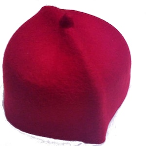 May include: A red felt fez hat with a small round top.