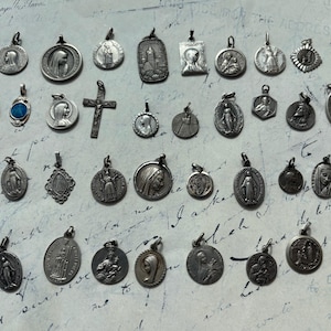 Antique French Holy Mary Religious Jesus Charms Pendants Vintage silver medailles choose from this set of 39 charms 22 inch pendant necklace