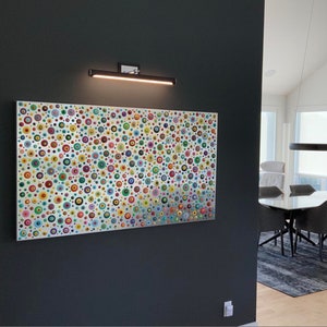 May include: A colorful abstract painting with a silver background featuring a pattern of various sized circles in shades of red, blue, green, yellow, and orange.