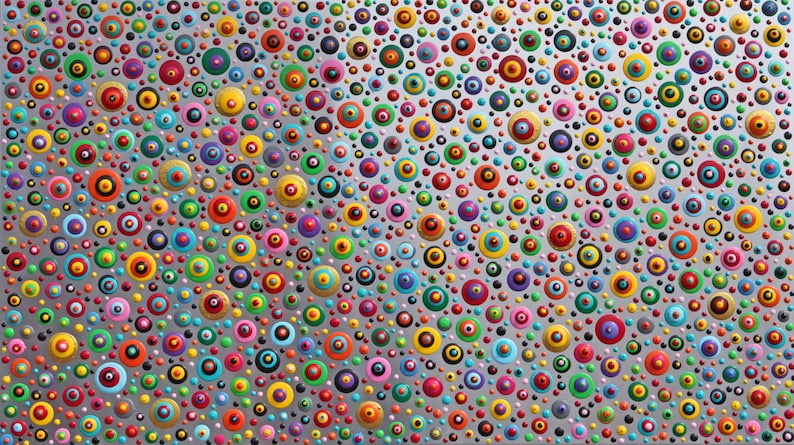 May include: A silver background with a pattern of colorful circles. The circles are of varying sizes and have a black center with a ring of color around it. The colors include red, orange, yellow, green, blue, purple, pink, and gold.