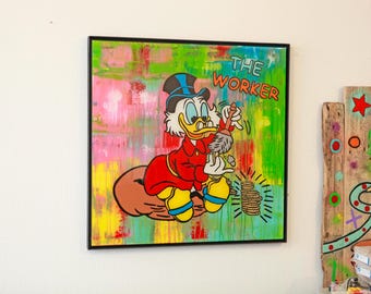 May include: A colorful painting of a cartoon duck wearing a red and black suit, holding a paintbrush and standing on a pile of gold coins. The painting has a green, pink, and yellow background with the text "THE WORKER" in black letters.