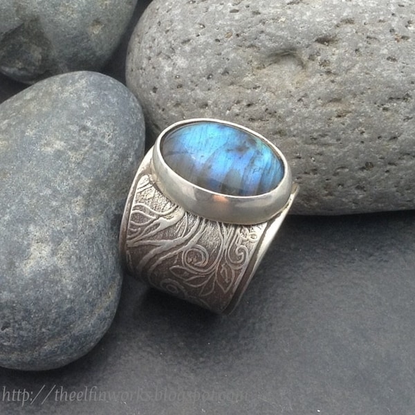 Labradorite ring, delicate swirling design on wide solid sterling metalwork band, oval stone with blue flash, fits size 7,