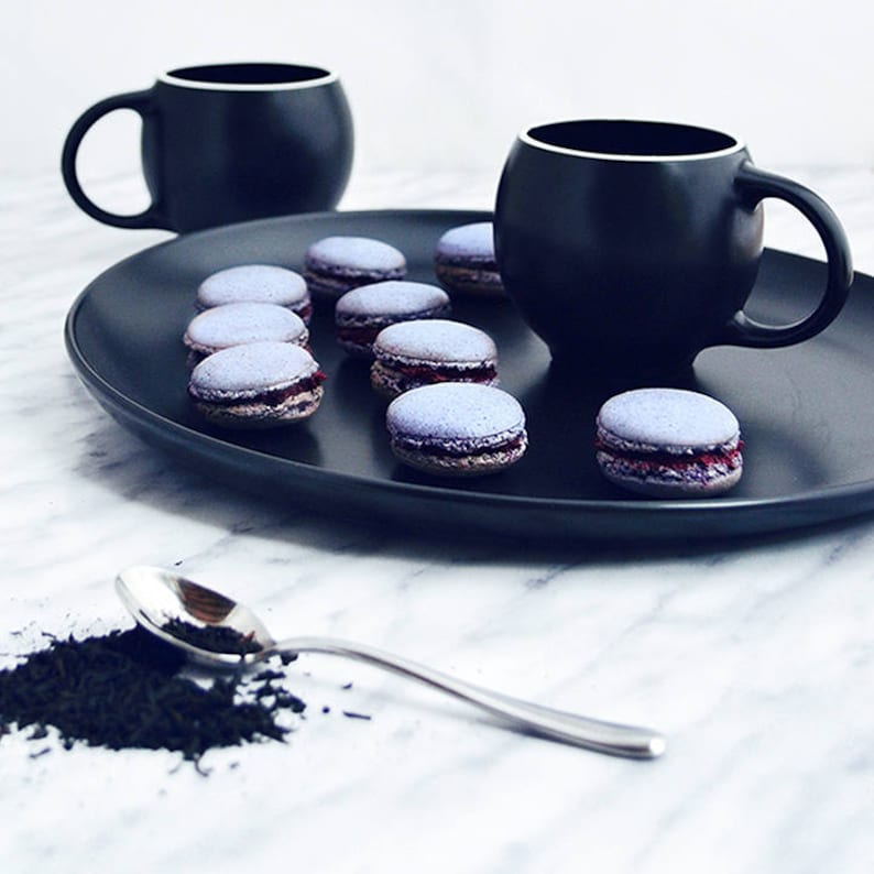 Modern minimalist Eva teacups in high-fired porcelain, by Maia Ming Designs and inspired by Eva Zeisel. Food-safe artisan pottery , a thoughtful gift for tea lovers or anyone who enjoys quiet morning rituals and sculptural Zen-inspired home decor.