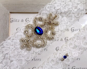 WHITE Lace with BLUE Gemstone Wedding Garter Set, Bridal Garter with CRYSTAL Rhinestone Crest Show & Petite Gemstone and Crystal Toss