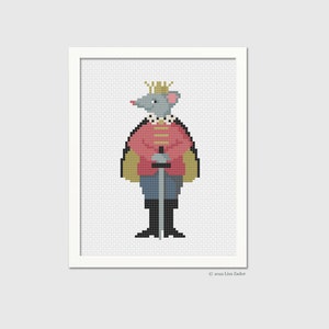 May include: A cross-stitch pattern featuring a gray mouse wearing a red and gold uniform with a sword. The mouse is wearing a gold crown and has a gray face.