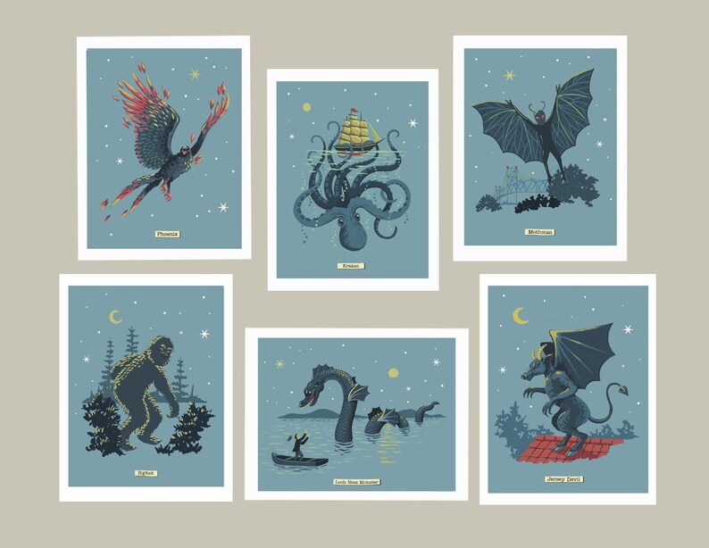 May include: Six illustrated cards featuring mythical creatures against a blue starry night sky. The cards feature a Phoenix, Kraken, Mothman, Yeti, Loch Ness Monster, and Jersey Devil.