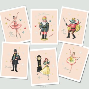 May include: Five illustrated cards with a pink background featuring characters from the Nutcracker ballet. The cards feature the Sugar Plum Fairy, the Nutcracker, the Mouse King, Drosselmeyer, and Clara.