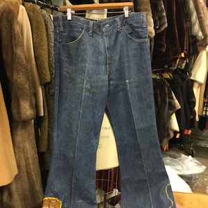 1970s Capricorn Black Power Fist Bell Bottom Blue Jeans