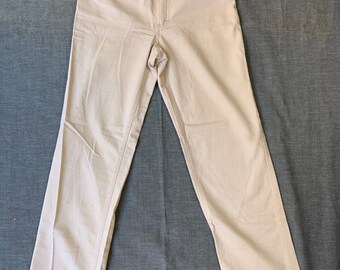 May include: A pair of light beige high-waisted jeans with a straight leg.
