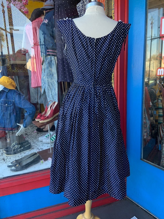 1950s blue polka dot dress Vintage 1950s early 60s turquoise blue optical illusion polka dots, atomic  era party dress.. Crafted in a sheer white organza overlay fabric scattered  with oversized turquoise and aqua blue polka dots, the
