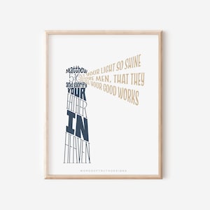 May include: A printable wall art design with a beige background and a dark blue text overlay. The text reads "Matthew 5:16 Let your light so shine before men, that they may see your good works and glorify your Father in heaven." The design is framed in a light wood frame.