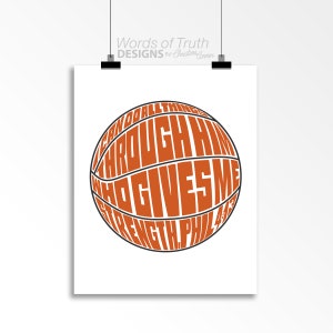 May include: A basketball with the words "I can do all things through Him who gives me strength. Phil 4:13" written on it in orange.